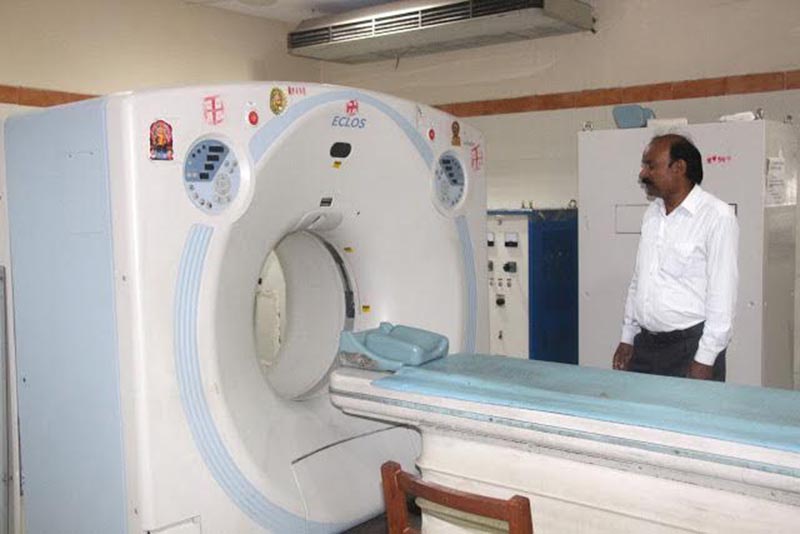 A technician inspecting a disfunctional CT scan machine in BP Koirala Institute of Health Sciences, Dharan, on Friday, May 26, 2017. Photo: THT