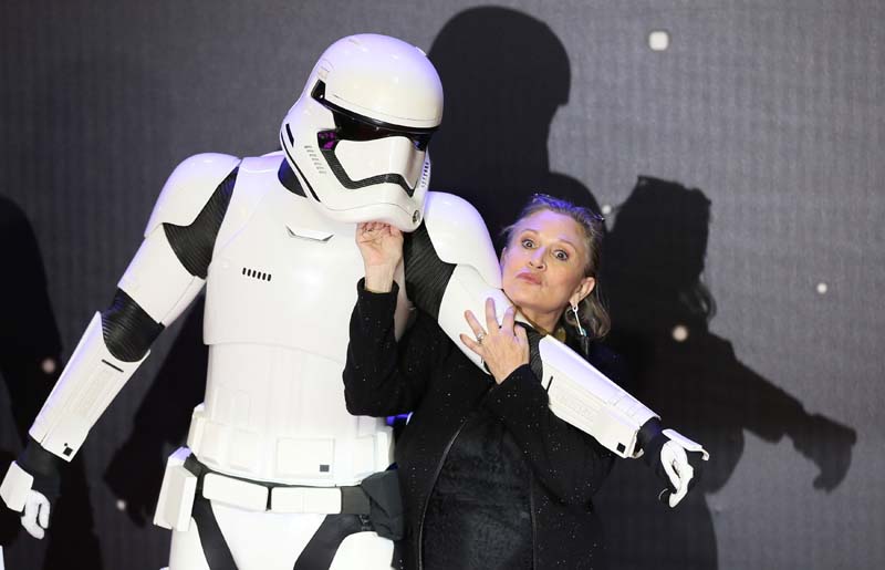 Carrie Fisher poses for cameras as she arrives at the European Premiere of Star Wars, The Force Awakens in Leicester Square, London, on December 16, 2015. Photo: Reuters/File