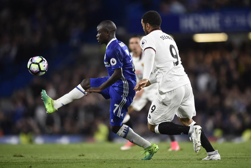 Chelsea's N'Golo Kante in action with Watford's Troy Deeney. Photo: Reuters