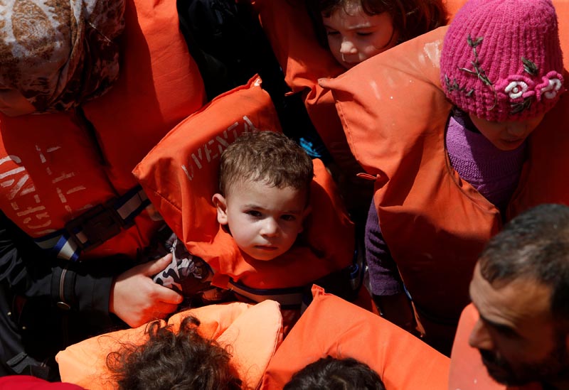 Child migrants wait to be brought onto the Malta-based NGO Migrant Offshore Aid Station (MOAS) ship Phoenix during a rescue operation in the central Mediterranean, in international waters off the Libyan coastal town of Sabratha, on May 4, 2017. Photo: Reuters