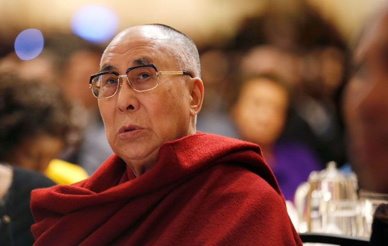 File - The Dalai Lama looks up toward the head table, where US President Barack Obama was seated, during the National Prayer Breakfast in Washington, on February 5, 2015. Photo: Reuters
