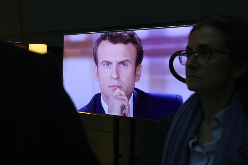 French presidential election candidate for the En Marche ! movement Emmanuel Macron is pictured on a television screen backstage, seconds before the start of a live broadcast televised debate in television studios of French public national television channel France 2, and French private channel TF1 in La Plaine-Saint-Denis, Paris, France, on May 3, 2017. Photo: Reuters