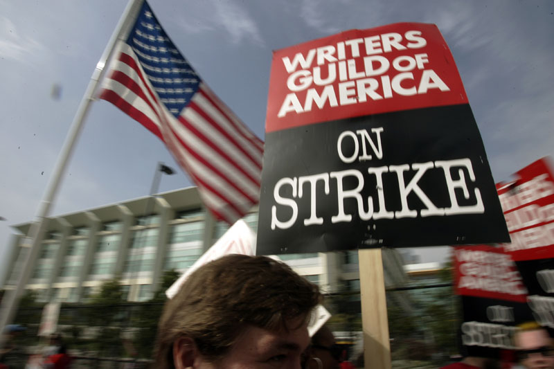 Writers Guild of America (WGA) writers and others strike against the Alliance of Motion Picture and Television Producers (AMPTP) in a rally at Fox Plaza in Los Angeles' Century City district, on November 9, 2007. Photo: AP/File