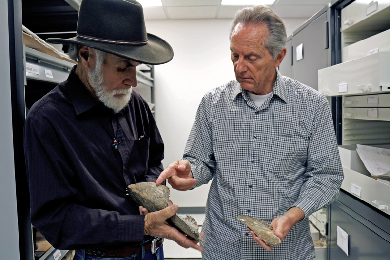 Retired Retired San Diego Natural History Museum Paleontologist Richard Cerutti (L) and Curator of Paleontology and Director of PaleoServices, DrTom Dem compare mastodon bones salvaged at the Cerutti Mastodon site in San Diego County, California, US, in this handout photo received April 26, 2017. Photo: Reuters
