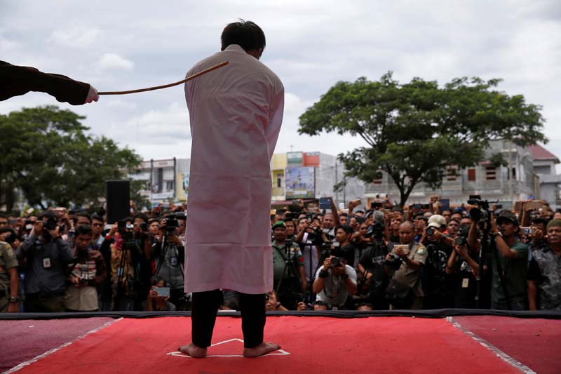 An Indonesian man is publicly caned for having gay sex, in Banda Aceh, Aceh province, Indonesia, on May 23, 2017. Photo: Reuters