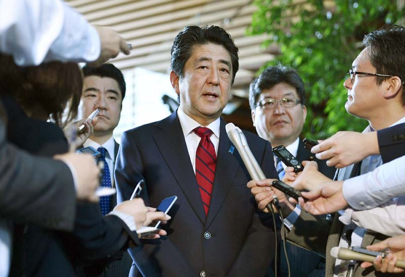 Japanese Prime Minister Shinzo Abe, (centre), answers to a reporter's question about North Korea's missile launch, at his official residence in Tokyo Monday morning, May 29, 2017. Photo: Muneyuki Tomari/Kyodo News via AP