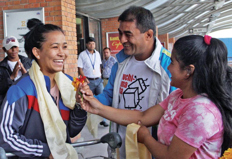 Judoka Manita Shrestha Pradhan is welcomed upon her arrival from Hong Kong, where she became the first Nepali woman to win a bout in the Asian Judo Championships, at The TIA, in Kathmandu, on Monday. Photo: THT