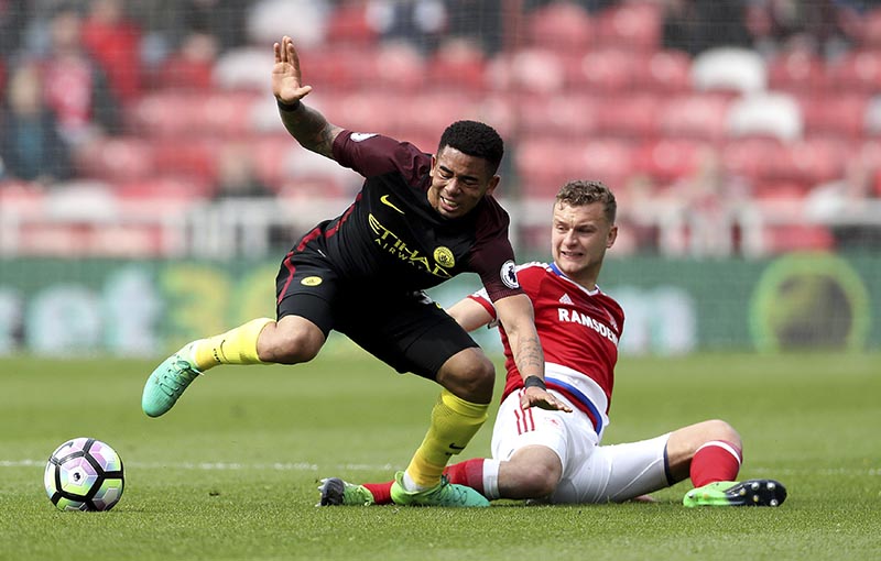 Middlesbrough's Ben Gibson (right) and Manchester City's Gabriel Jesus in action during their English Premier League soccer match at the Riverside Stadium in Middlesbrough, England, on Sunday April 30, 2017. Photo: Owen Humphreys/PA via AP