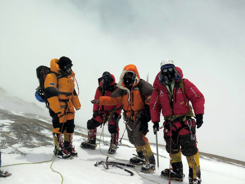 In this undated photo, climbers pose for a photograph on the top of Mount Dhaulagiri. Photo Courtesy: Migma Sherpa