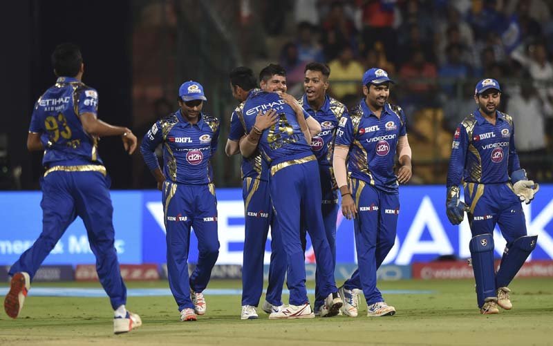Mumbai Indians Karn Sharma, (centre), celebrates the wicket of Colin De Grandhomme of Kolkata Knight Riders with his team players during the Indian Premier League cricket eliminator match in Bangalore, India, on Friday, May 19, 2017. Photo: AP