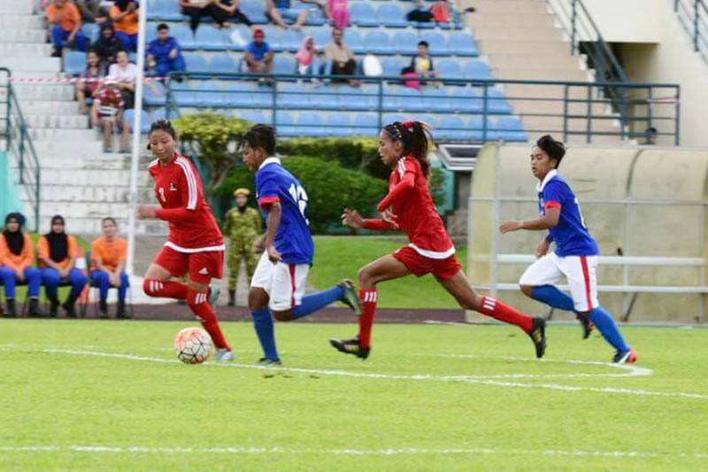 A Malaysian player makes a surging forward run against Nepal during an International Friendly football match. Courtesy: ANFA