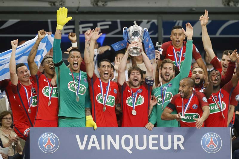 Paris Saint-Germain's celebrates with their trophy after winning the French Cup 2017 Final soccer match, between Paris Saint-Germain (PSG) and Angers at Stade de France in Saint Denis, north of Paris, France, on Saturday, May 27, 2017. Photo: AP