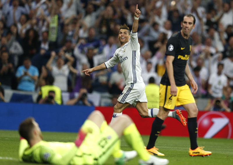 Real Madrid's Cristiano Ronaldo celebrates scoring his side's 2nd goal during the Champions League semifinal first leg soccer match between Real Madrid and Atletico Madrid at the Santiago Bernabeu stadium in Madrid, Spain, on Tuesday, May 2, 2017. Photo: AP