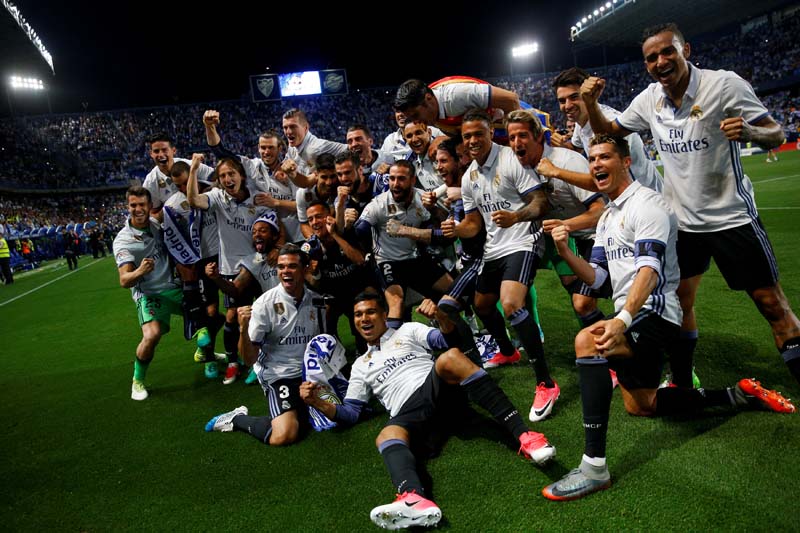 Real Madrid celebrate after winning La Liga soccer match between Malaga and Real Madrid in Malaga, Spain, on Sunday, May 21, 2017. Photo: Reuters