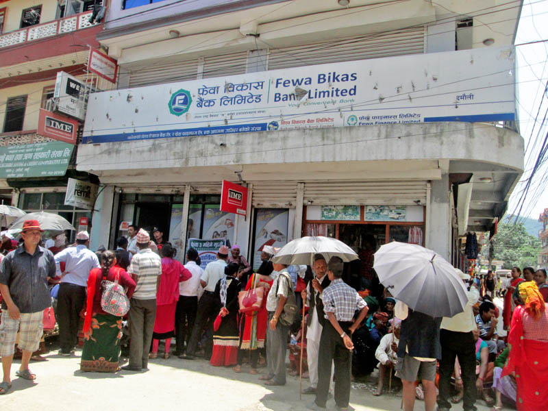 Senior citizens queuing to receive their social security allowance at Damauli-based Phewa Development Bank in Tanahun district, on Sunday, May 28, 2017. Photo: Madan Wagle