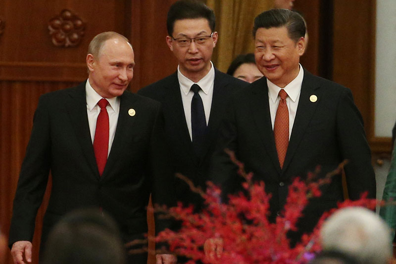Chinese President Xi Jinping (right) and Russian President Vladimir Putin (left) arrive for a welcome banquet for the Belt and Road Forum at the Great Hall of the People in Beijing, China, on 14 May 2017. Photo: Reuters