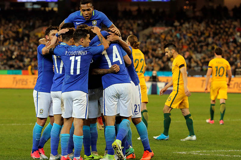 Brazil's Alex Sandro celebrates with his teammates after the second goal. Photo: Reuters