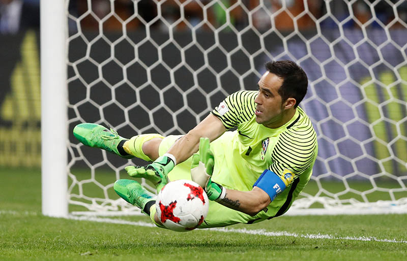 Chileu2019s Claudio Bravo saves from Portugalu2019s Nani to win the penalty shootout. Photo: Reuters