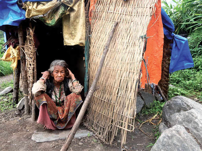 A woman sitting in front of a hut in Gaurishankar Rural Municipality, Dolakha, on Saturday, June 24, 2017. Photo: THT