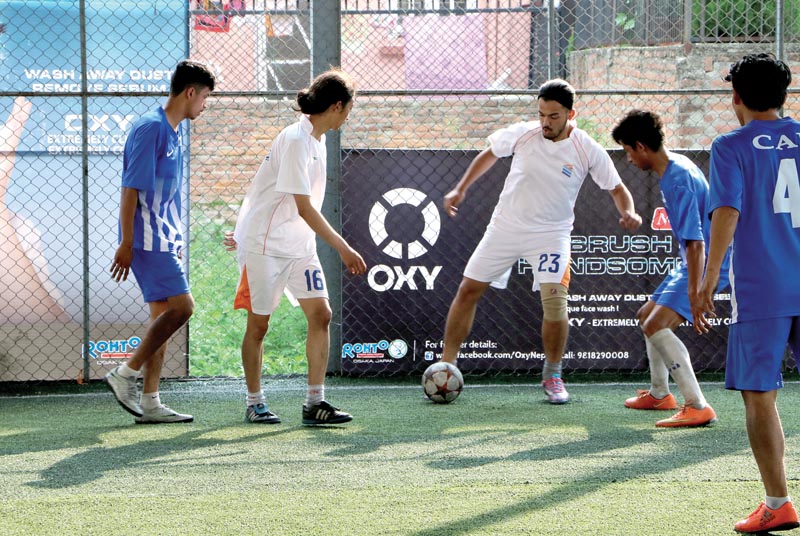 Players of Kings College and CAB in action during the Oxy Inter-college Futsal Tournament, on Sunday. Photo: THT
