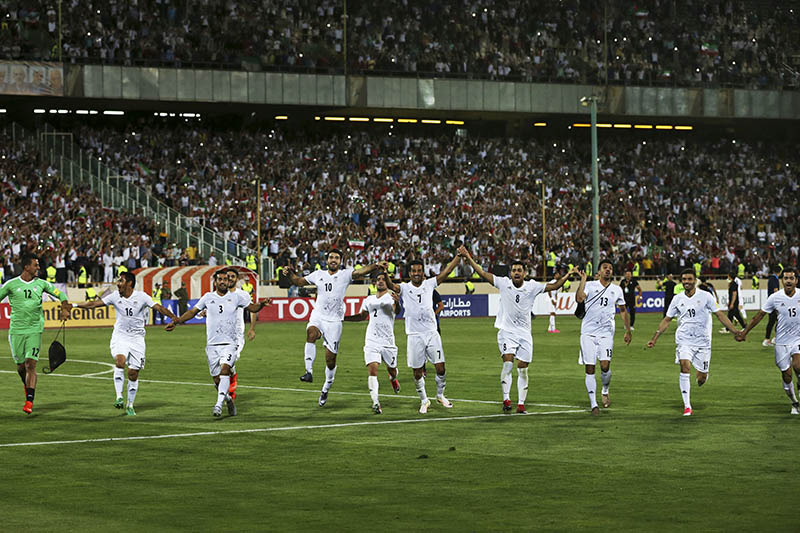Iran national soccer team players celebrate after beating Uzbekistan in their Asia Group A, 2018 World Cup qualifying soccer match at the Azadi Stadium in Tehran, Iran, Monday, June 12, 2017. Photo: AP