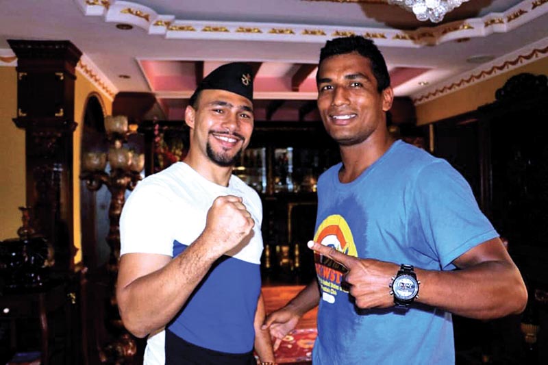 Seven-time Nepal champion Manohar Basnet poses with American professional boxer Keith Thurman (left) in Kathmandu on Monday. Photo: THT