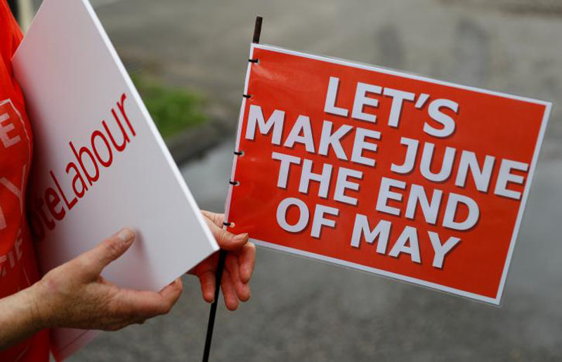 A supporter waits for Jeremy Corbyn, leader of Britain's opposition Labour Party, to arrive at a campaign event in Reading, on May 31, 2017. Photo: Reuters