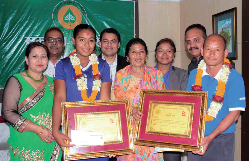 Pratibha Mali and New Diamond Academy coach Kumar Rai after being honoured with the Sher Bahadur Khadka Memorial Sports Awards in Kathmandu on Wednesday, June 21, 2017. Photo: THT