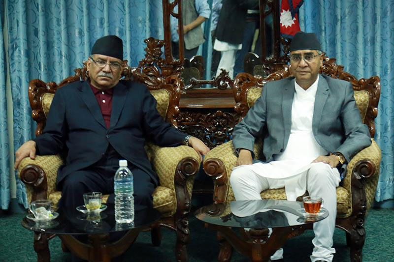 PM Sher Bahadur Deuba (right) meets CPN Maoist Centre's chairperson Pushpa Kamal Dahal at Speaker's office in Singha Durbar, on Tuesday, June 13, 2017. Photo: RSS