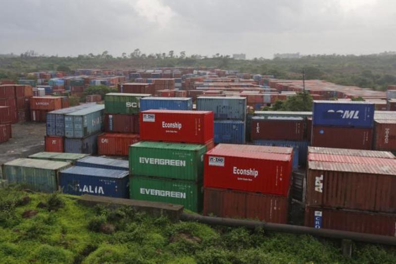 Cargo containers are seen stacked outside the container terminal of Jawaharlal Nehru Port Trust (JNPT) in Mumbai, India, on July 15, 2015. Photo: Reuters/ File