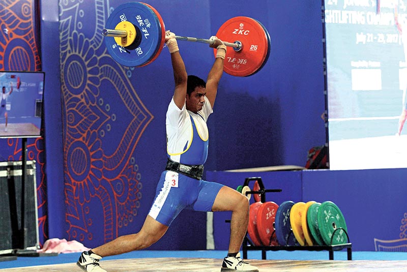 Nepal's Bishal Singh Bista lifts weight during the Youth and Junior Asian Weightlifting Championships, on Friday. Photo: Udipt Singh Chhetry/ THT