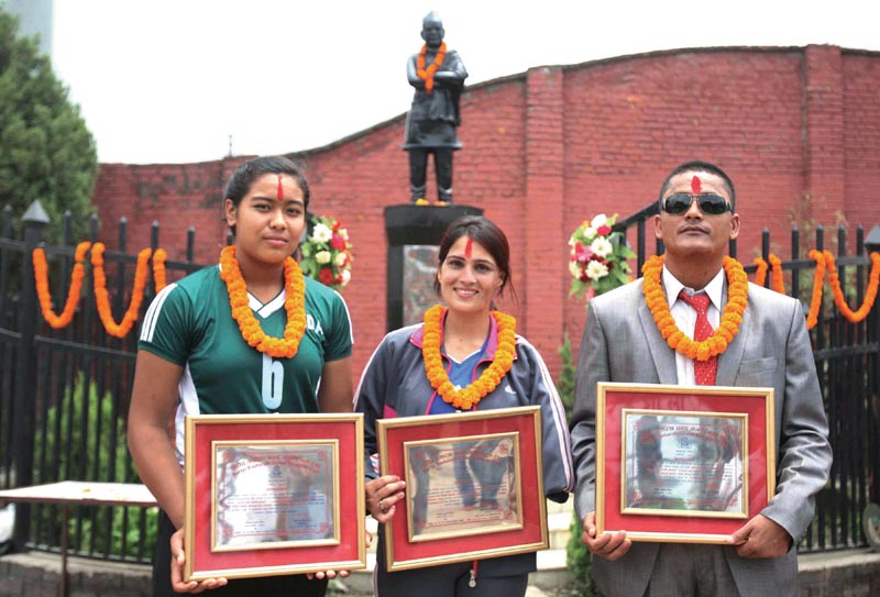 (From left) Pratibha Mali, Sita Bhandari and Bikram nBahadur Rana after being felicitated by Martyr Dasharath Chand Memorial Trust in Kathmandu, on Saturday. Photo: THT