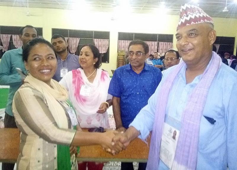Newly elected Mayor Dhawal Shumsher Rana of RPP (right) and Deputy Mayor Uma Thapa Magar (NC) shaking hands in Nepalgunj Sub-metropolitan City Office, Banke, on Tuesday, July 4, 2017. Photo: THT