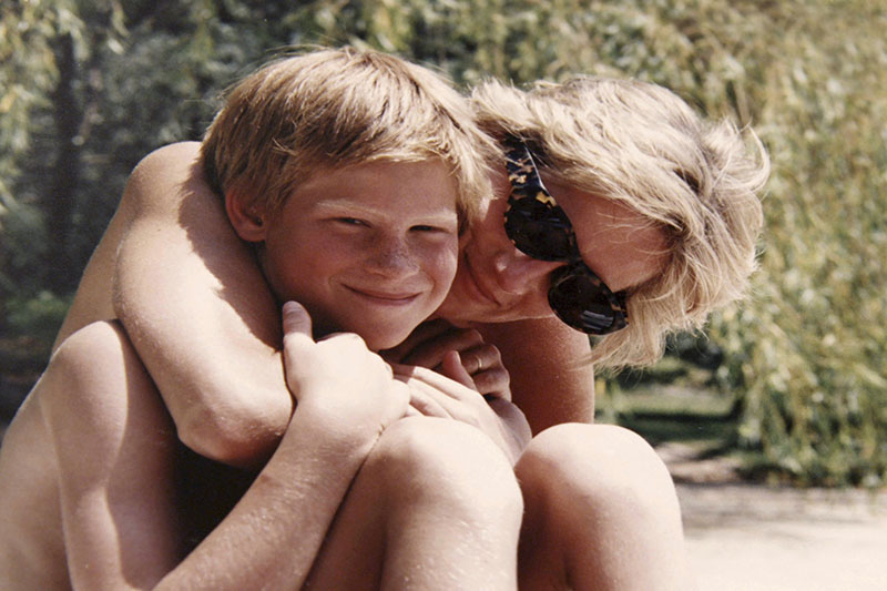 In this photo made available by Kensington Palace from the personal photo album of the late Diana, Princess of Wales, shows the princess and Prince Harry on holiday. Photo: AP
