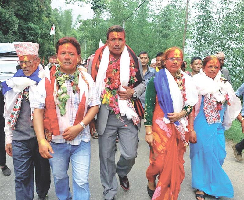Elected CPN-UML candidates of ward No. 5 of Ilam Municipality taking out a rally, in Ilam, on Sunday, July 2, 2017. Photo: RSS