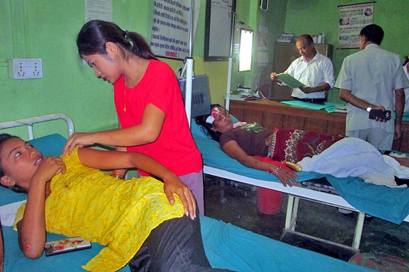 Health Professionals are seen treating the people injured in the Gunadi bus accident, at the Ratna Hari Hospital, in  Damauli, of Tanahu district, on Sunday, July 9, 2017. Photo: Madan Wagle
