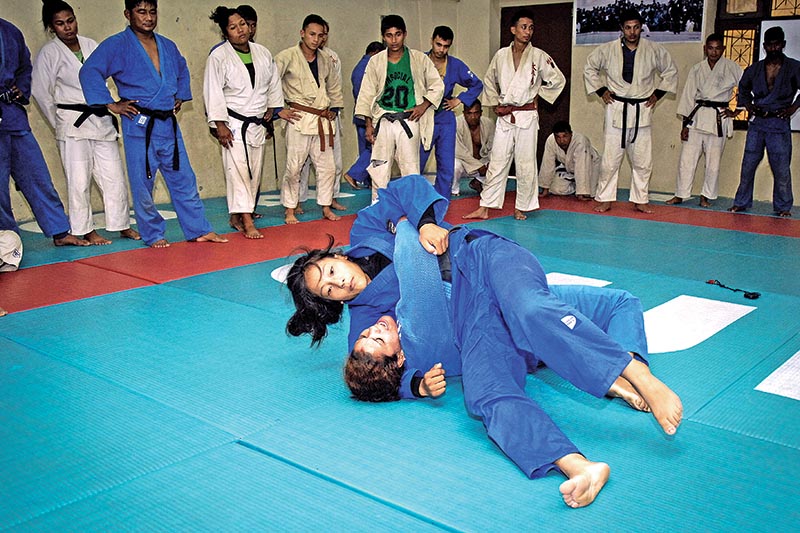 Judoka Phupu Lhamu Khatri fights with her coach Debu Thapa during a training session in Kathmandu, on Sunday. Photo: Naresh Shrestha/ THT