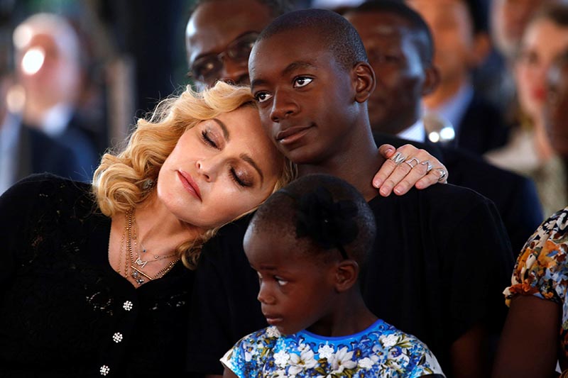 US singer Madonna embraces her adopted son, David Banda ahead of the opening of the Mercy James hospital in Blantyre, Malawi, on July 11,2017. Photo: Reuters