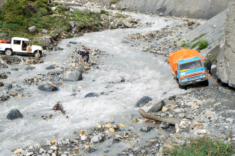 Vehicles are seen parked on the side of the flooded Pisang Khola, in Nesyang Rural Municipality-3, Manang, on Wednesday, 5 July 2017. Photo: RSS