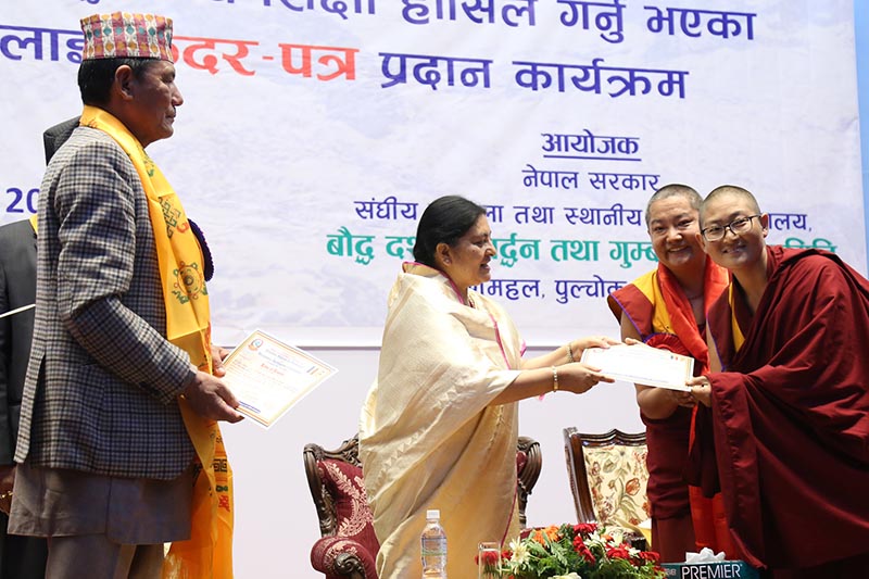 President Bidya Devi Bhandari honouring individuals who earned higher education in Buddhist philosophy, on Thursday, July 27, 2017. Photo: RSS