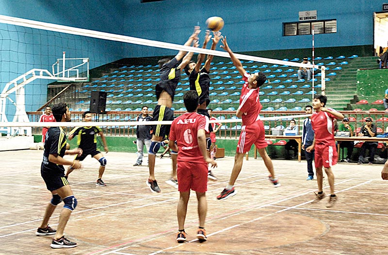 Players of Far-western University (left) and Agriculture and Forestry University in action during their second Prime Minister Cup University Games at the NSC covered hall in Kathmandu on Thursday. Photo: Naresh Shrestha / THT