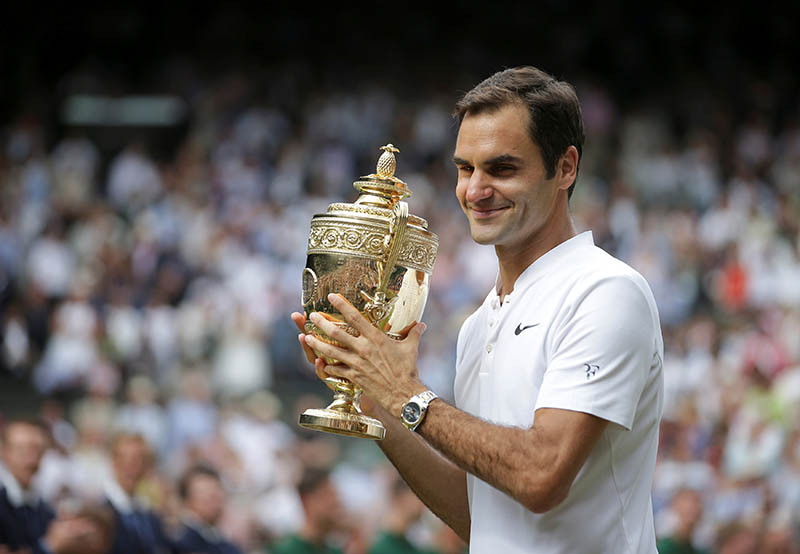 Switzerlandu2019s Roger Federer poses with the trophy as he celebrates winning the final against Croatiau2019s Marin Cilic. Photo: Reuters