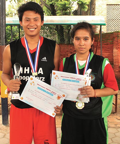 Bishal Rai and Binamra Khatri hold the MVP awards of the 11th Shridiwa Monsoon Meet in Kathmandu, on Sunday. Photo: THT