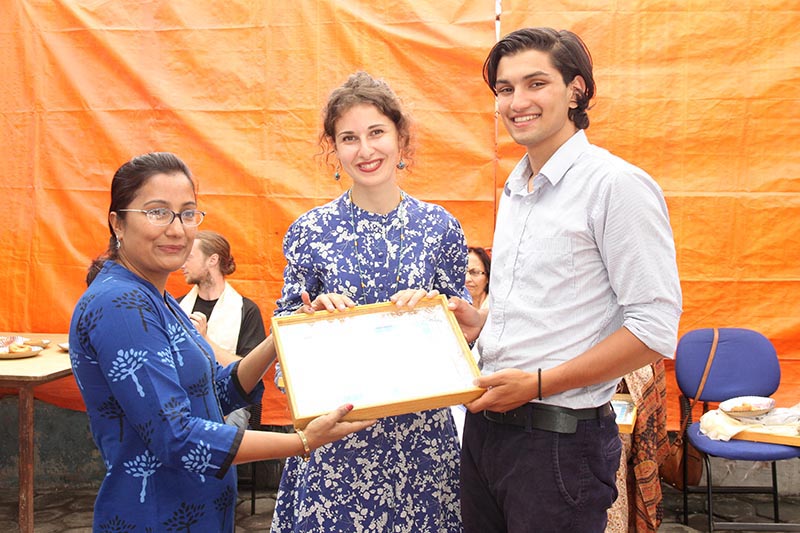 Himanshu (right) and Nano (centre) being presented letter of appreciation by a member of Special Education and Rehabilitation Centre for Disabled Children, in Kathmandu, for their support to SERC, in Kathmandu, in July, 2017. Photo: THT