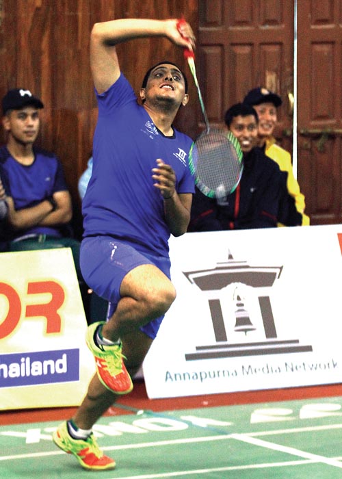 Sudeep Sedhai of APF returns to Hari Prasad of Bhutan during their Annapurna International Badmintion Tournament match in Kathmanu, on Saturday. Photo: THT