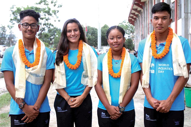 Swimmers from left Anubhab Subba, Sophia Shah, Tisa Shakya and Subham Shrestha take group photo during their farewell to participate in the FINA World Championship in Budapest, Hungary at National Sports Council, Tripureshwor in Kathmandu on Tuesday. Photo: Udipt Singh Chhety/ THT