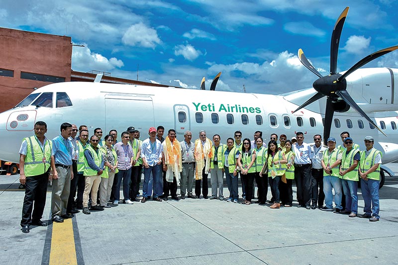 Members of Yeti Airlines posing in front of the new ATR 72-500 aircraft after its arrival at the Tribhuvan International Airport, in Kathmandu. Courtesy: Yeti Airlines