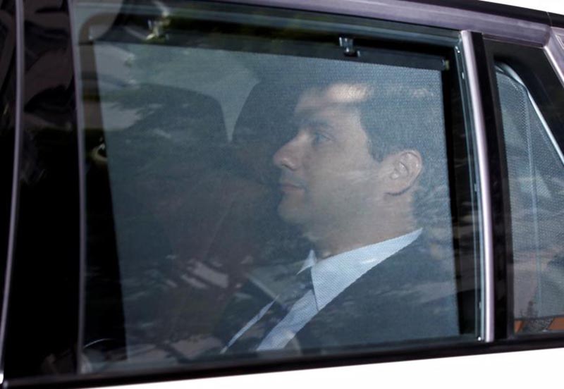 Mark Karpeles, chief executive of defunct bitcoin exchange Mt Gox, rides in a car as he arrives at Tokyo District Court for a trial on charges of embezzlement in Tokyo, Japan, on July 11, 2017. Photo: Reuters