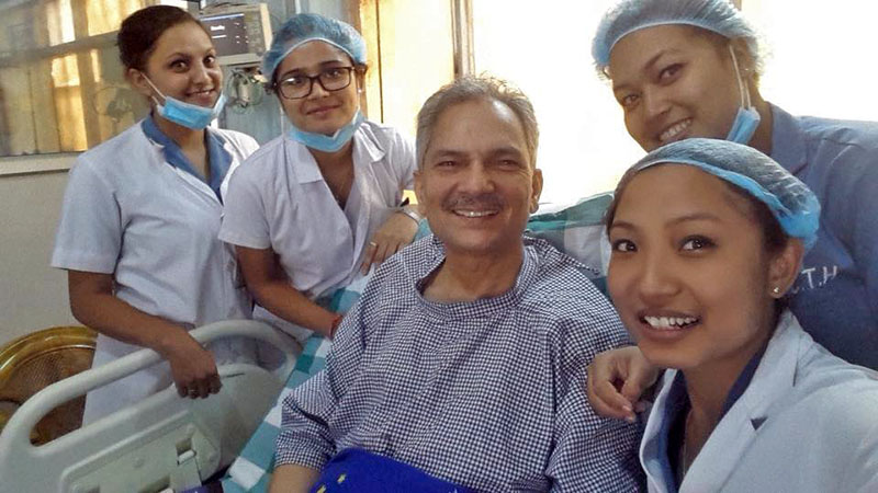 Former PM Baburam Bhattarai pose for a portrait along with hospital nurses after undergoing prostrate gland surgery at the Nagarik Community Hospital, on Monday, August 7, 2017. Courtesy: Baburam Bhattarai/Facebook