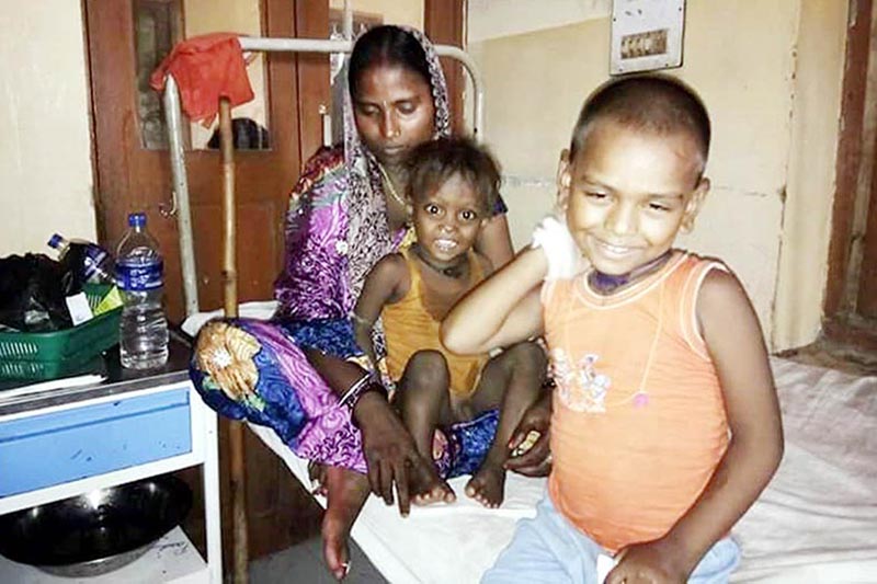 Flood victim Renudevi, who has already lost one child, getting treatment for her other children at Narayani Sub-regional Hospital, in Birgunj, Parsa, on Thursday, August 24, 2017. Photo: THT